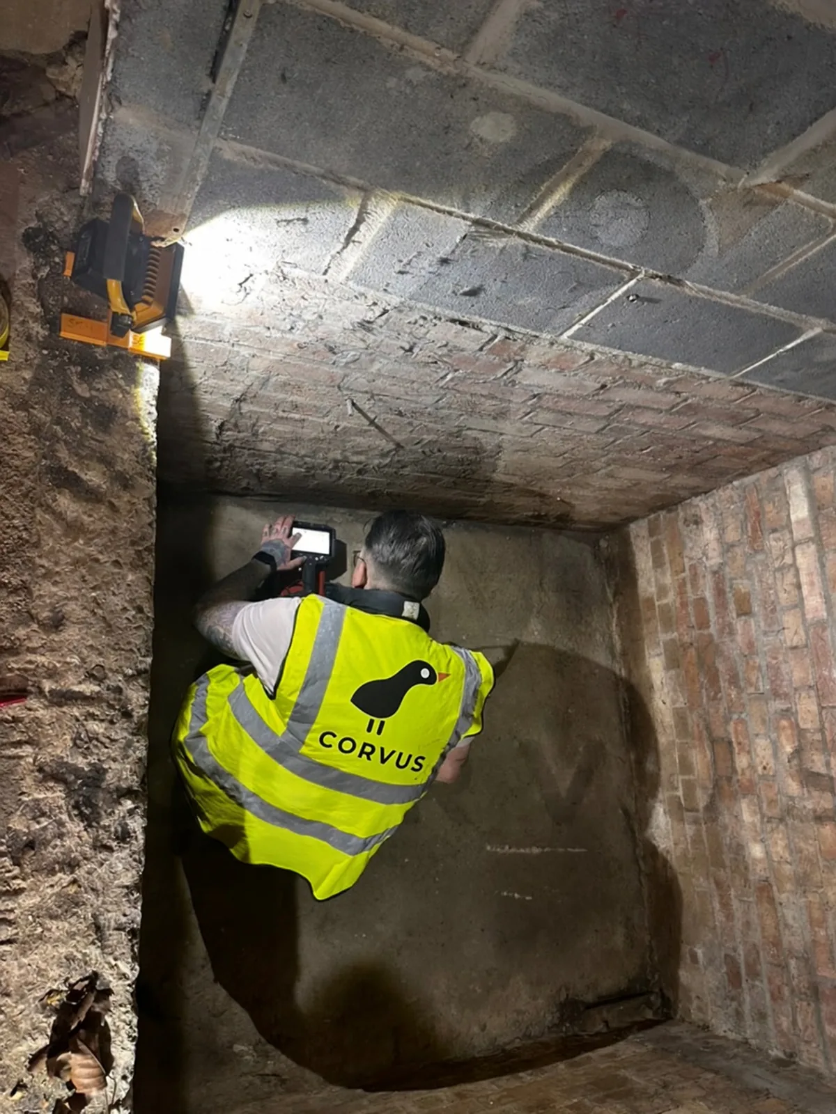 Corvus surveyor scanning a lift pit wall with GPR before installation